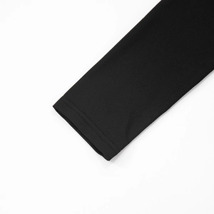 Detailed close-up of double-needle stitching on black long sleeve cuff fabric
