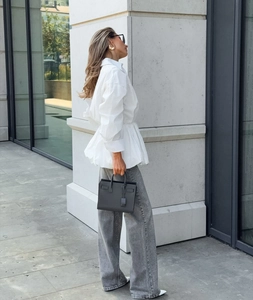 Detail view of white long sleeve peplum shirt with stylish waist pleats for women