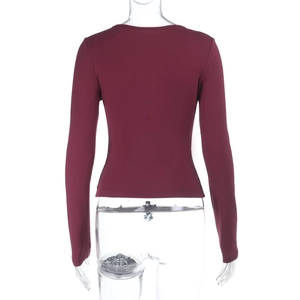 Back view showing the slim fit cut and fine stitching of the burgundy knit top
