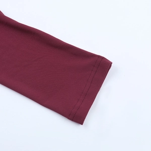 Close-up of double-needle stitching on burgundy long sleeve shirt cuff detail