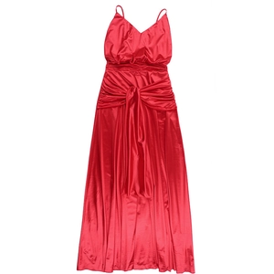 Macro detail of glossy red satin fabric with pleated waist and large decorative bow on dress