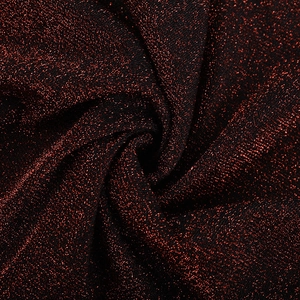 Gros plan sur la texture du tissu Lurex scintillant rouge et noir pour robes