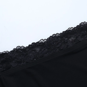 Detail of delicate black floral lace stitching and fabric texture on a Y2K mini dress