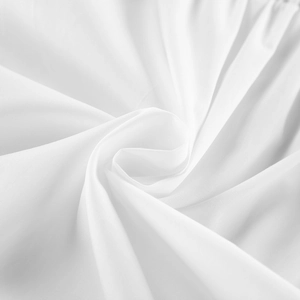 Macro shot of white cotton fabric showing smooth texture and soft silk-like sheen