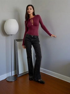 Slim fit burgundy long sleeve t-shirt with hollow-out neck and flared black jeans