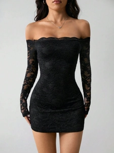Detail of elegant black lace off-the-shoulder dress with intricate floral crochet texture