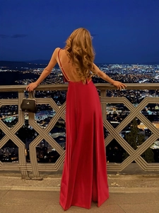 Elegant red off-the-shoulder evening dress with open back and flowing A-line silhouette