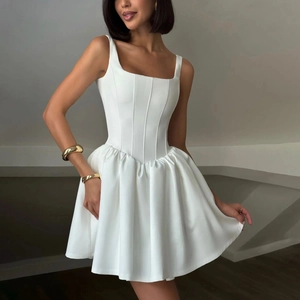 Detailed view of the white corset-style mini dress with square neck and puffed skirt