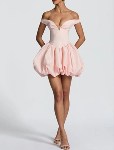 Detail of light pink off-the-shoulder mini dress featuring a voluminous bubble skirt design