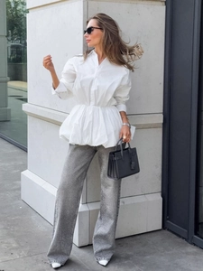 White long-sleeve cotton shirt with peplum hem and grey sequined wide-leg trousers