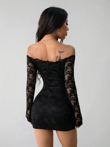 Slim fit black lace off-the-shoulder long sleeve mini dress back view showing floral pattern
