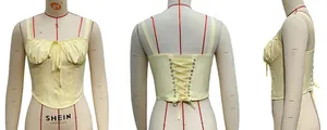Detailed views of the yellow lace corset top with lace trim and adjustable back lacing