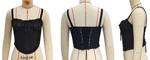 Detail view of black corset camisole featuring lace trim and back lace-up design