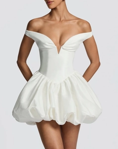 Detail of white off-the-shoulder bubble hem dress featuring a structured V-neckline