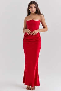 Detail of elegant dark red strapless corset dress with draped waist and a slim A-line fit