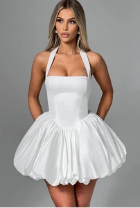 Detail view of white halter neck mini dress with structured corset bodice and bubble skirt