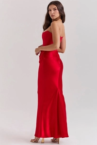 Detail of elegant red strapless slim-fit dress with shiny satin fabric and fishtail hem