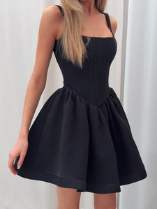 Elegant black corset mini dress with sleeveless design and voluminous pleated skirt