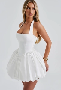 Detail of white halter neck dress with corset bodice and fluffy bubble hemline design