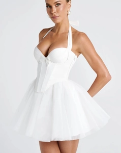 Detail of white corset bodice with fishbone support and delicate mesh tulle skirt