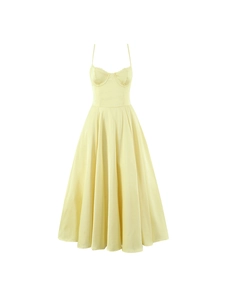 Elegant light yellow midi dress with thin straps and corset-style bodice on white background