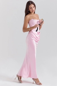 Detailed view of pink satin strapless dress featuring waist pleats and shimmering fabric