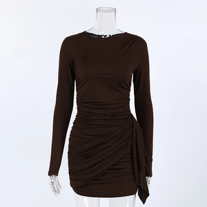 Detail view of ruched dark brown bodycon mini dress with asymmetrical hem and ribbons