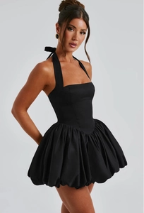 Detailed view of the sleek black halter neck bodice and voluminous balloon skirt silhouette