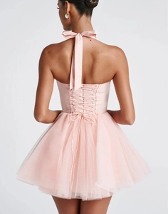 Detailed back view of light pink halter corset dress with criss-cross lace-up ribbon