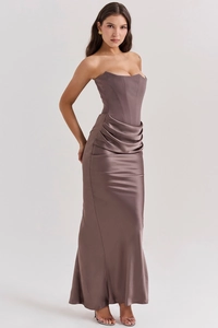Detail of elegant strapless mocha satin gown featuring a corset bodice and ruched draping