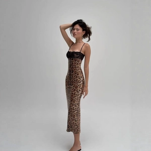 Detail of lace neckline and leopard print fabric on a bodycon midi dress
