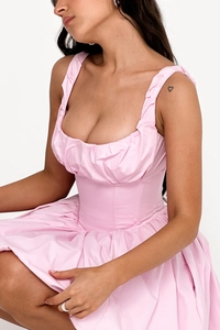 Detailed close-up of pink ruched bust and corset-style waist on a summer dress