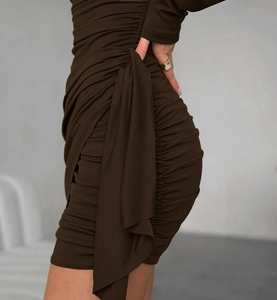 Detail view of ruched dark brown mini dress with elegant side ribbons and slim fit design