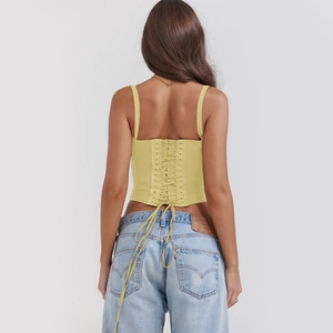 Detailed back view of lime green lace-up corset top with adjustable spaghetti straps