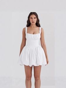 White mini dress with slim waist, off-shoulder neckline and puffy pleated skirt