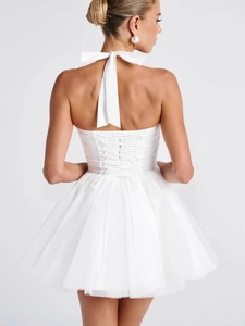 Elegant white halter neck dress with corset back and layered tulle skirt back view