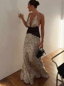 Elegant polka dot halter maxi dress with lace waist detailing for party or vacation
