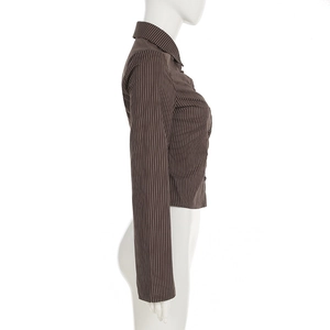 Side view of brown striped cotton shirt with lapel collar and slim fit tailoring
