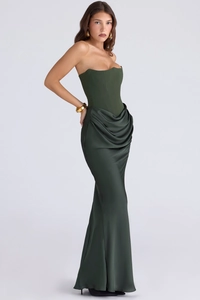 Detail of corset structure and asymmetrical draped satin fabric on olive green evening gown