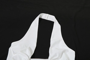 Detailed view of the white halter neck stitch and neckline of this backless dress