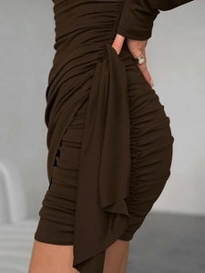 Chocolate brown bodycon mini dress with ruched design and elegant side drape detail