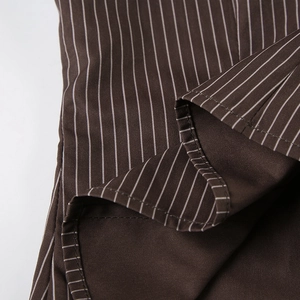 Macro detail of high-quality brown and white striped cotton fabric texture and stitching