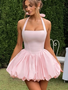 Pink halter neck puff mini dress with bow tie detail and tiered ruffled skirt style