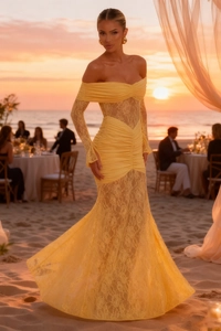 Detailed view of yellow off-shoulder lace evening gown with elegant ruffle texture