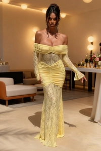 Detail of elegant off-shoulder light yellow lace evening gown with ruched slim fit texture