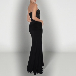 Detail of elegant black lace off-shoulder top and fitted fishtail evening dress silhouette