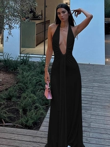 Elegant black halter maxi dress with a deep V-neckline and open back for summer parties