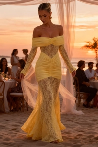 Detail of off-shoulder yellow lace evening gown featuring sheer textures and fisheye hem