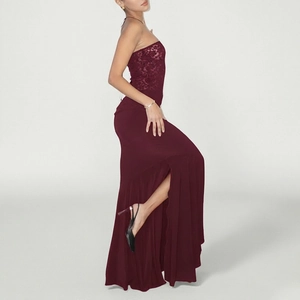 Close-up of wine red slim evening dress featuring lace splicing and side high slit detail