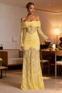 Detailed view of the yellow off-shoulder evening dress with lace inserts and pleats
